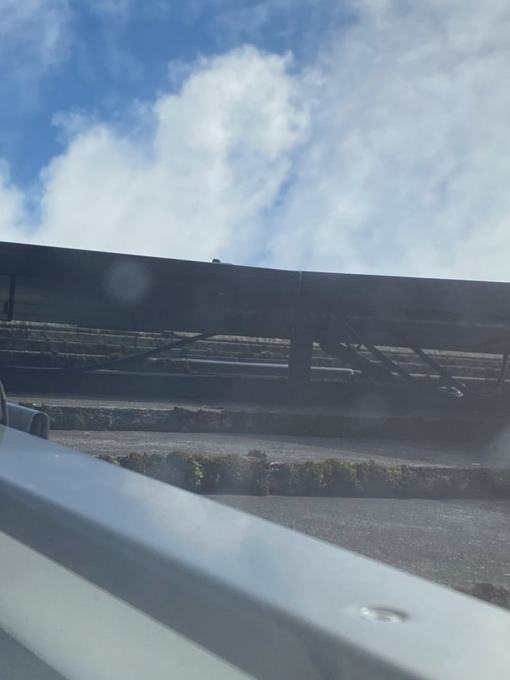 A row of solar panels on a galvanised ground-mount frame